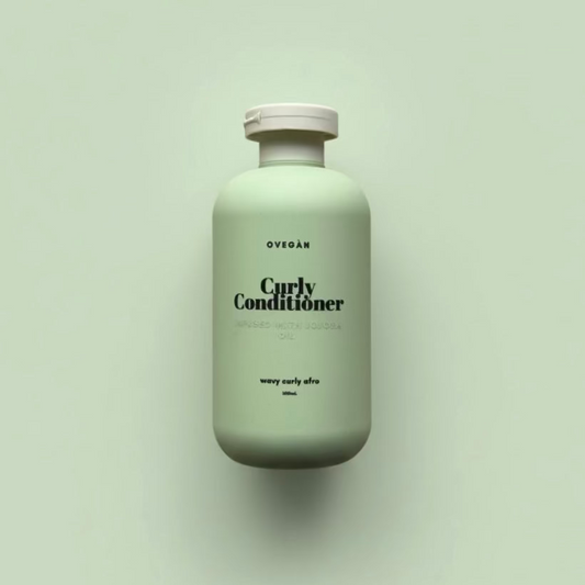 Green bottle of 'Curly Conditioner' on a light green background